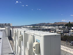 bird proofing applied to heat pumps on an industrial commercial building